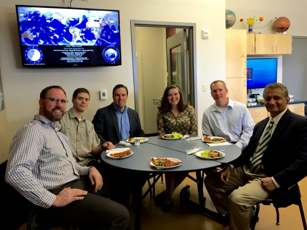 enjoying pizza in the multi-purpose room